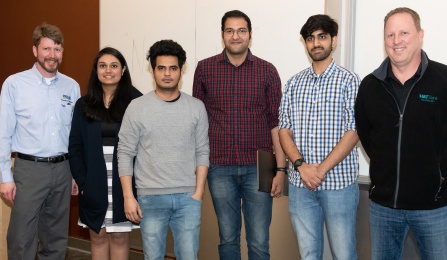 Zoom image: Alan Hunt, Demo Day host and CSE 611 instructor; Demo Day 2019 first place winners Pranjal Jain, Saurab Chauhan, Pranav Vij, and Nikhil Lala; and Sonny Sonnenstein, Demo Day sponsor and M&amp;T Bank SVP &amp; CIO, Consumer, Business, and Digital Banking 
