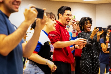 University at Buffalo tudents smiling at a competition. 
