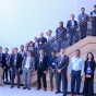 IEEE Nano-symposium attendees - several people - stand in front of and on a large staircase. 