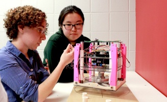 Students work on project hardware. 