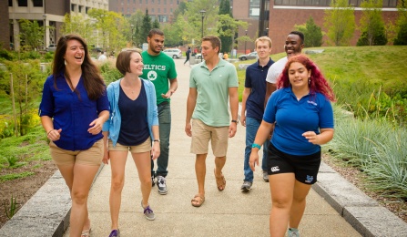 Students walking outside Davis Hall. 