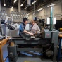 students in the machine shop. 