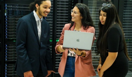 LSAMP Faculty Mentor with two summer interns in a server room. 