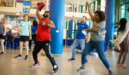 People dancing in a group. 