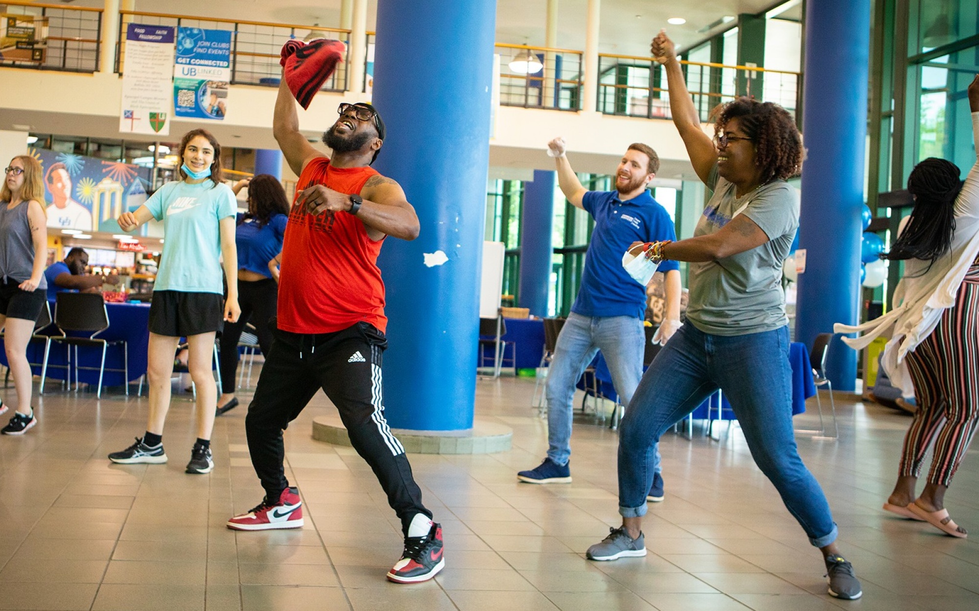 People dancing in a group. 