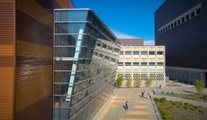 People walk outside of Davis Hall. 