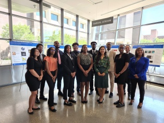 LSAMP students in front of their posters after a poster session in Davis Hall. 