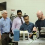 Magtrol execs in a lab with UB faculty. 