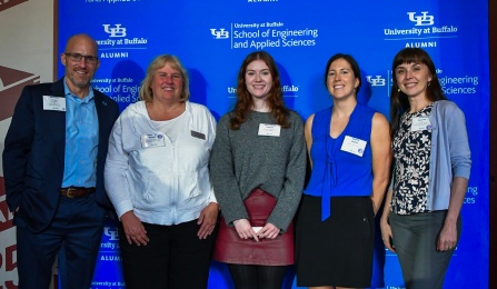 Five women pose for a group photo. 