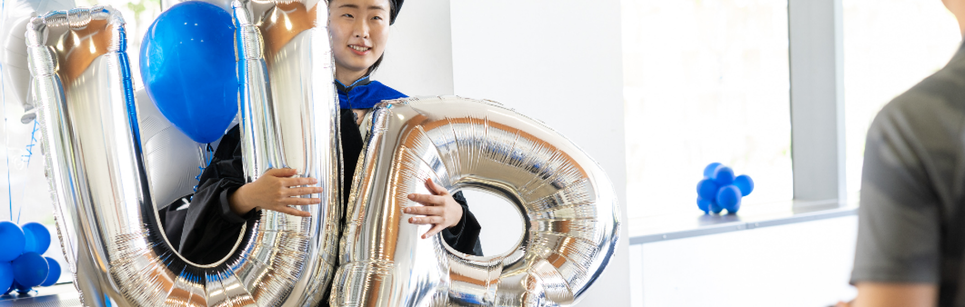 students in commencement regalia. 