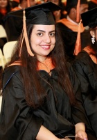 Zoom image: MS degree candidate in commencement regalia. 