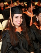Zoom image: MS degree candidate in commencement regalia. 