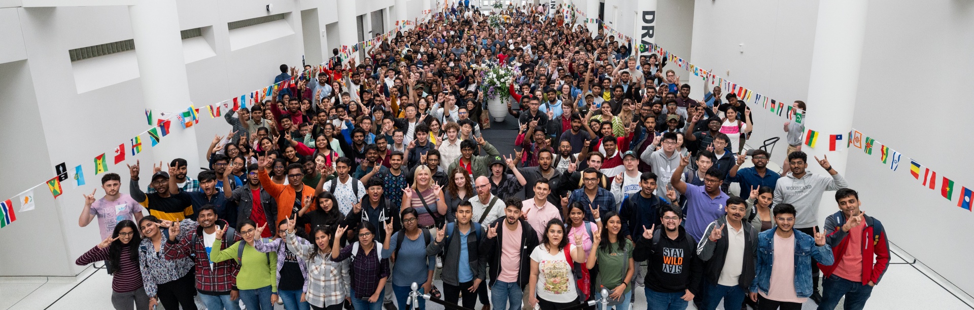 A new class of incoming University at Buffalo graduate students within the School of Engineering and Applied Sciences gather in the Center for the Arts on the North Campus for a group photo. 