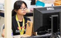 girl programming on computer. 