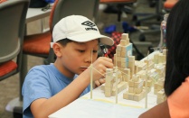 Boy using building blocks. 