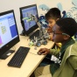 Students programming robot. 