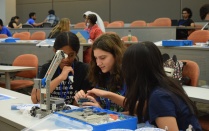 Students building robot. 