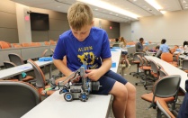 student working on robot. 