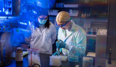 Two women doing wastewater research in a UB lab. 