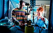 Dr. Zirnheld doing research with a student in a high voltage lab. 