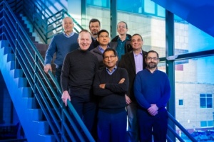 Zoom image: University at Buffalo researchers from multiple departments will play a key role in the $7.5 million project. Bottom row, from left: Paras Prasad, principal investigator, and Luis Velarde. Middle row, from left: Jonathan Bird, co-principal investigator, Hao Zeng and Mark Swihart. Top row, from left: Andrey Kuzmin, Vasili Perebeinos and Alexander Baev. Credit: Douglas Levere / University at Buffalo 