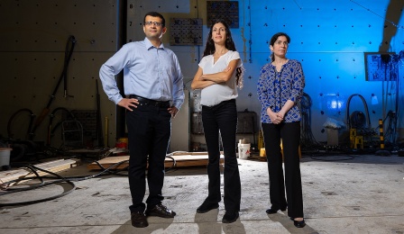 A portrait of Ravi Ranade (left), Pinar Okumus (center), and Negar Elhami-Khorasani (right), all faculty members in the department of civil, structural and environmental engineering, photographed in Ketter Hall in September 2023. 