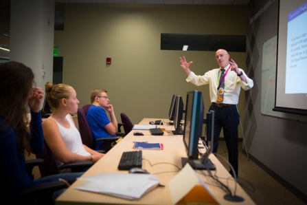 Prof. E. Bruce Pitman lectures high school students as part of the Eric Pitman Summer Workshop in Computational Science. 