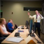 Prof. E. Bruce Pitman lectures high school students as part of the Eric Pitman Summer Workshop in Computational Science. 