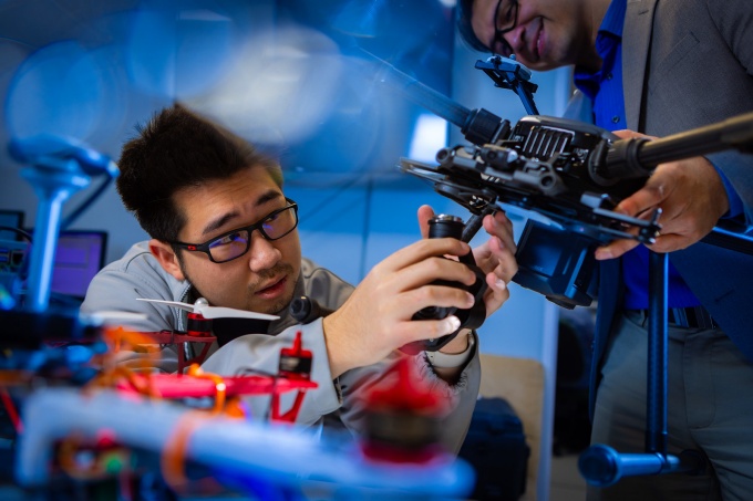Students work on drones and other unmanned vehicles in the lab of Souma Chowdhury. 