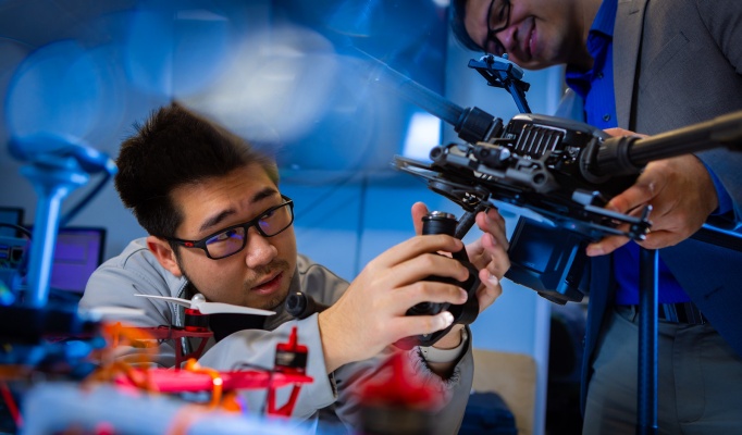 Students work on drones and other unmanned vehicles in the lab of Souma Chowdhury. 