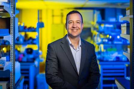 Jon Lovell protrait in his lab. 